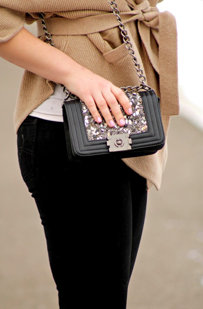 crossbody bag and black jeans