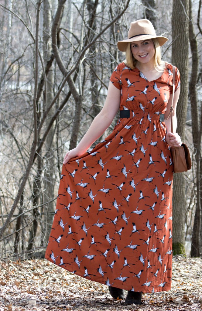 Felt fedora and stork print dress